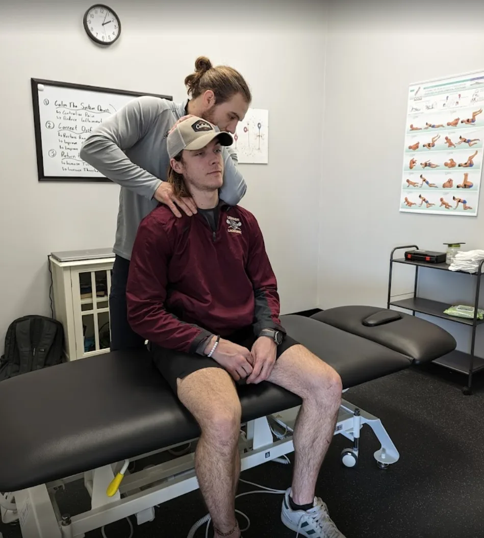 Neck pain chiropractic adjustment at SISU Spine & Rehab Springboro Ohio